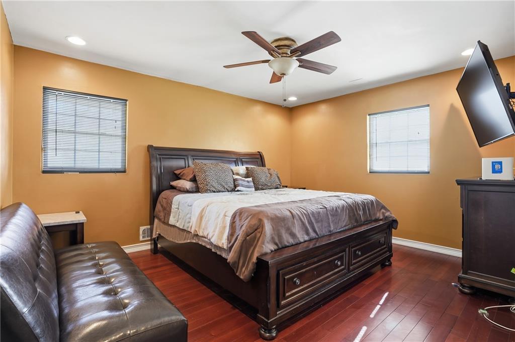 8926 Ashton Road Jonesboro, GA 30238 - Photo 14 of 32 a bed room with a bed and a tv