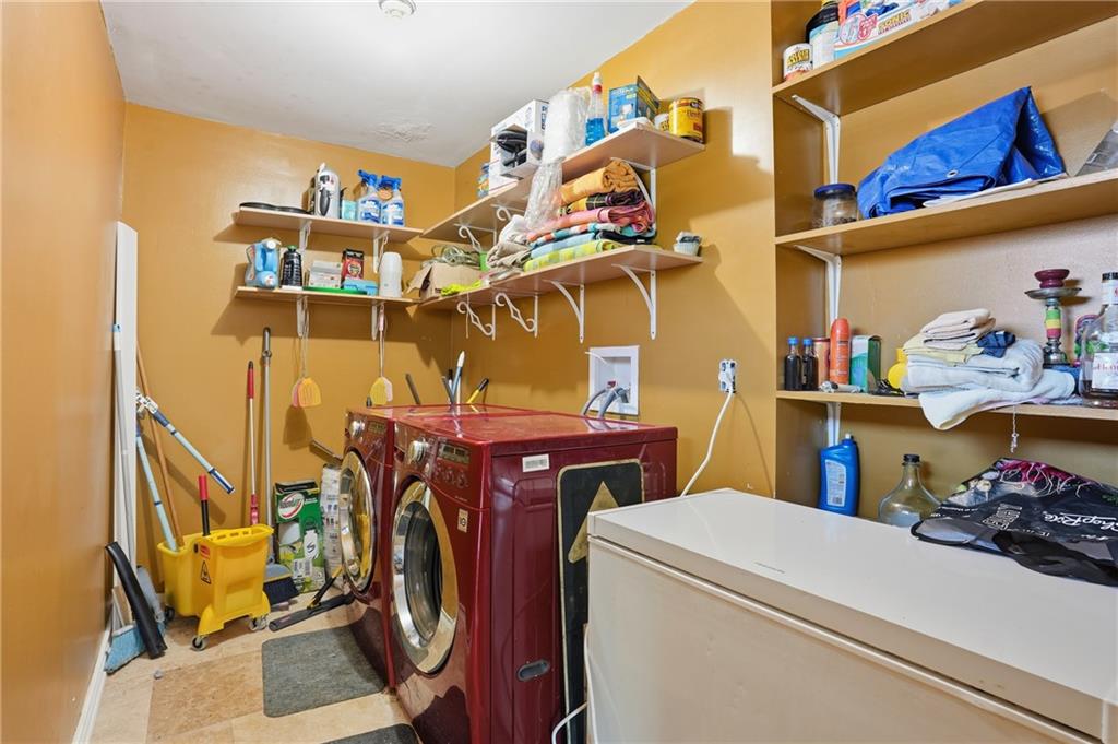8926 Ashton Road Jonesboro, GA 30238 - Photo 21 of 32 a utility room with dryer and washer