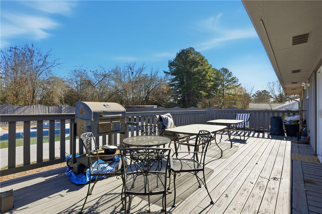 8926 Ashton Road Jonesboro, GA 30238 - Photo 22 of 32 a view of a chairs and table on the deck