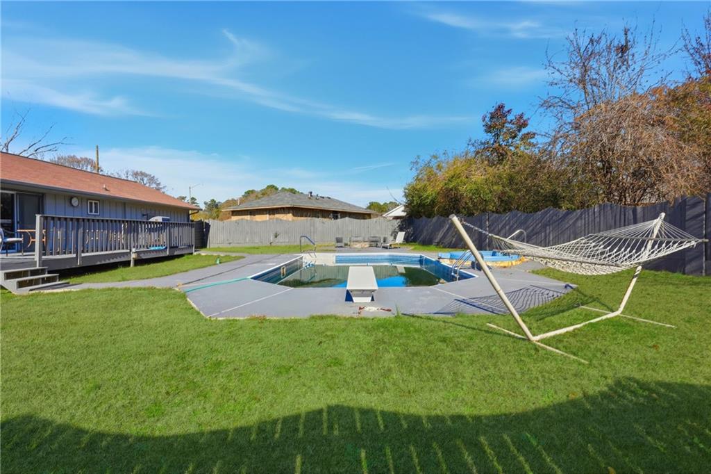 8926 Ashton Road Jonesboro, GA 30238 - Photo 23 of 32 a view of a backyard with a patio