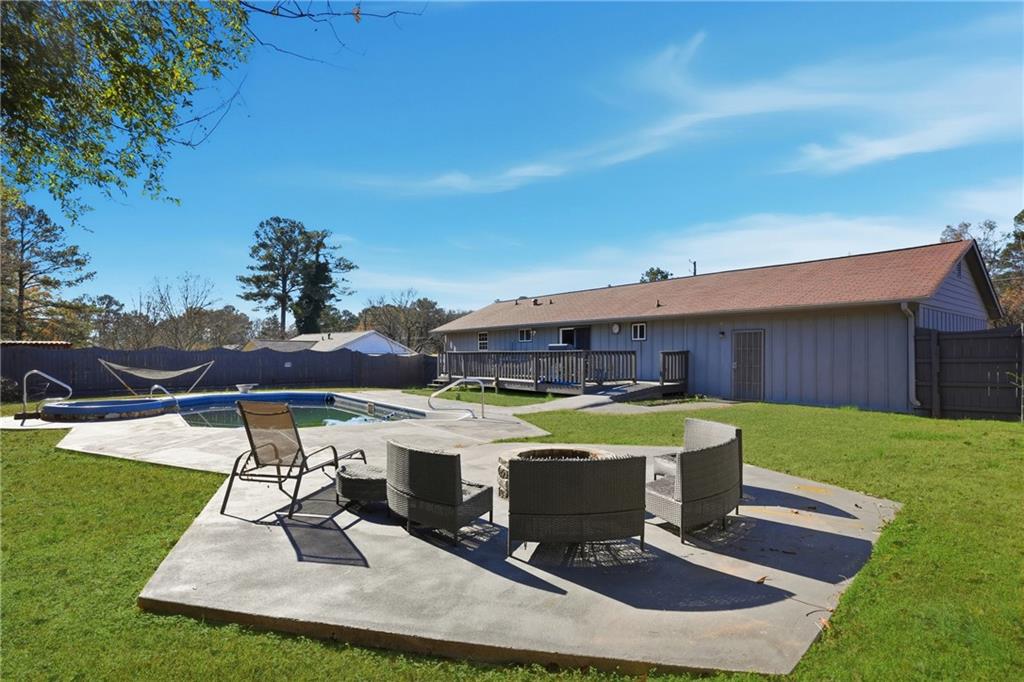 8926 Ashton Road Jonesboro, GA 30238 - Photo 25 of 32 a view of a swimming pool with a patio