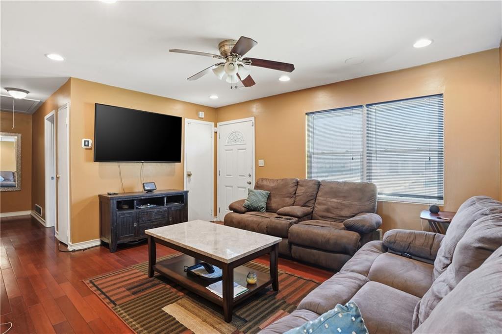 8926 Ashton Road Jonesboro, GA 30238 - Photo 4 of 32 a living room with furniture and a flat screen tv