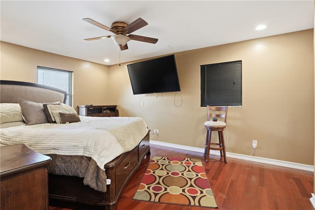 8926 Ashton Road Jonesboro, GA 30238 - Photo 8 of 32 a bedroom with a bed and a flat screen tv