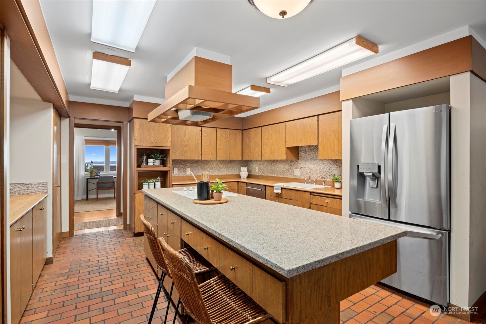 911 17th Street Bellingham, WA 98225 - Photo 22 of 39 a kitchen with stainless steel appliances a refrigerator and a stove