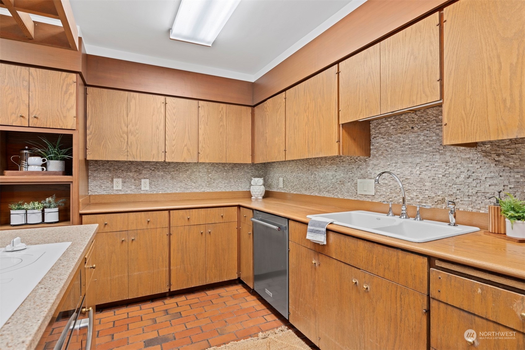 911 17th Street Bellingham, WA 98225 - Photo 23 of 39 a kitchen with stainless steel appliances granite countertop a sink stove and cabinets