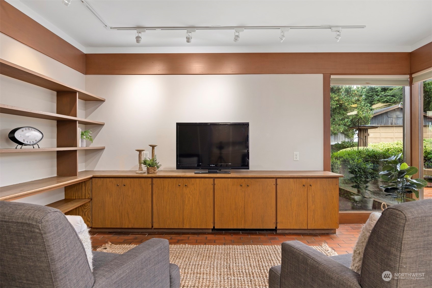 911 17th Street Bellingham, WA 98225 - Photo 24 of 39 a living room with a couch and a flat screen tv