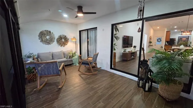 a view of a livingroom with furniture and entryway
