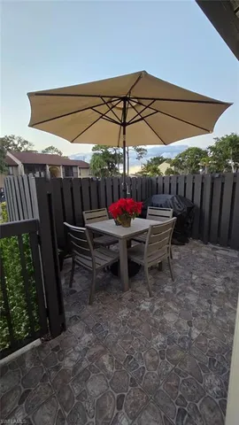 a view of a chairs and table in the patio