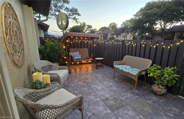 a view of a chairs and tables in patio