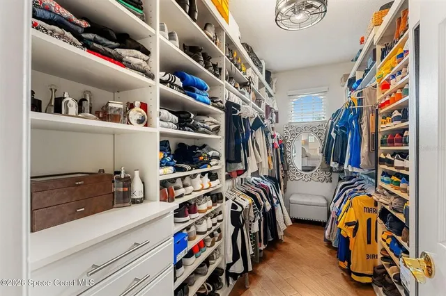 a living room with furniture a rug and a window