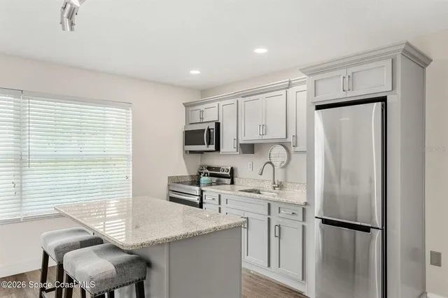 a backyard of a house with wooden fence