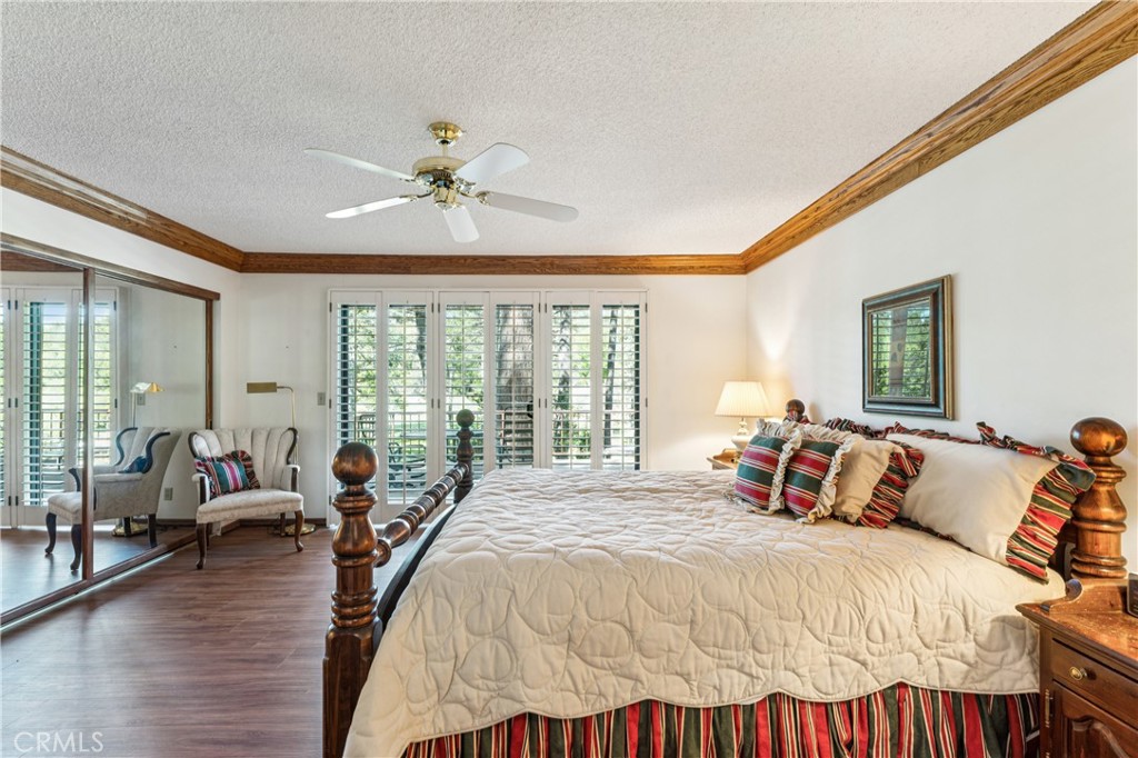 524 Golf Course Road Lake Arrowhead, CA 92352 - Photo 28 of 71 a bed room with a bed and a large window