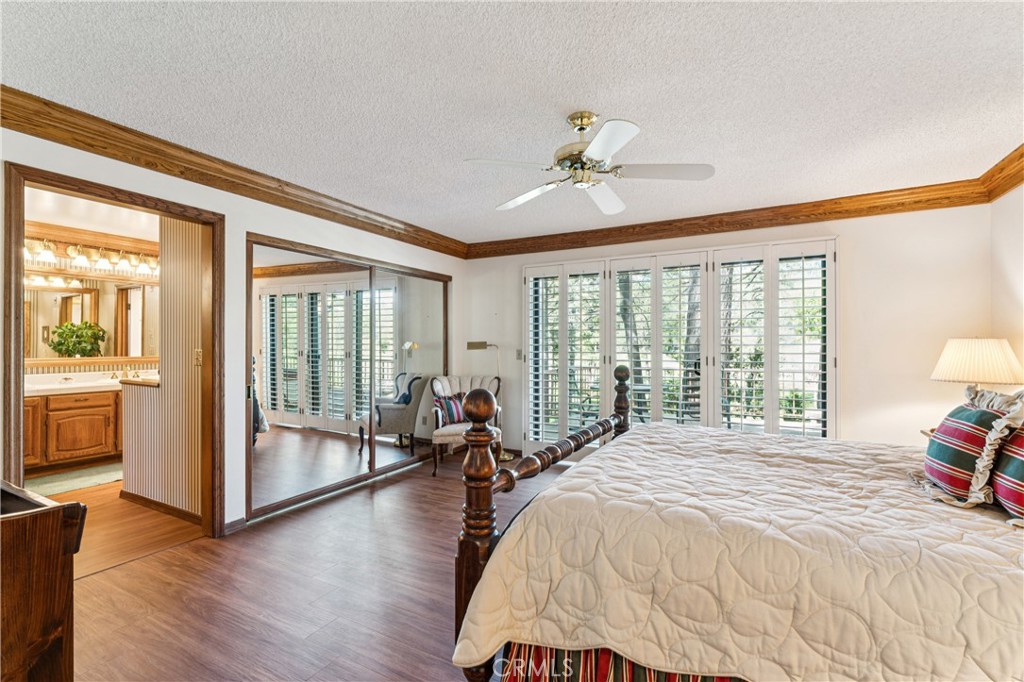 524 Golf Course Road Lake Arrowhead, CA 92352 - Photo 29 of 71 a bedroom with a large bed and a balcony view