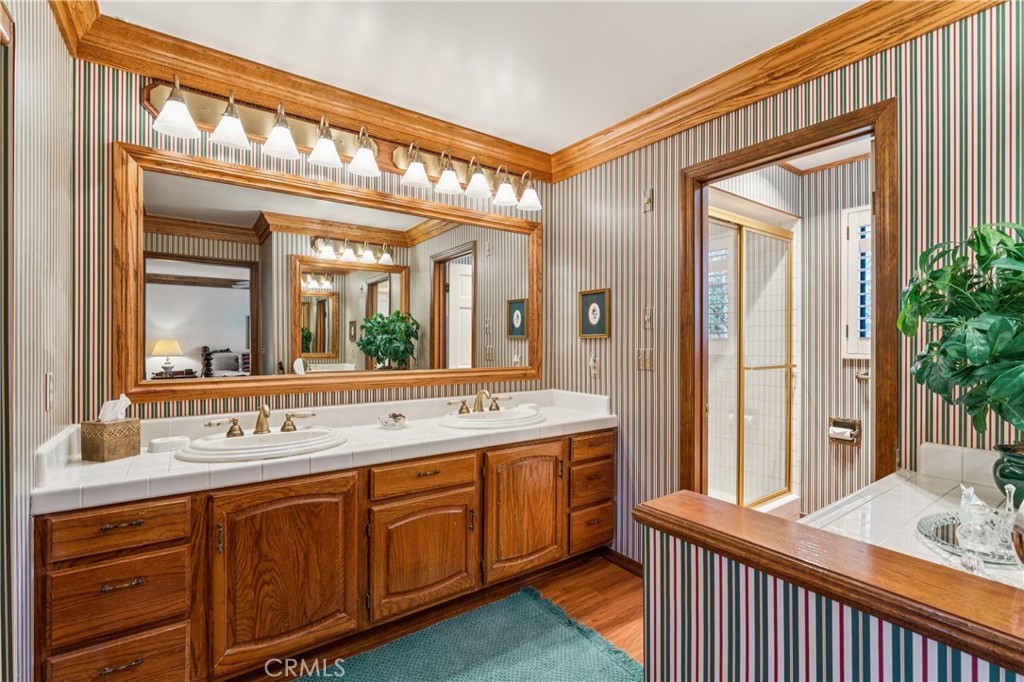 524 Golf Course Road Lake Arrowhead, CA 92352 - Photo 30 of 71 a bathroom with a sink and a mirror