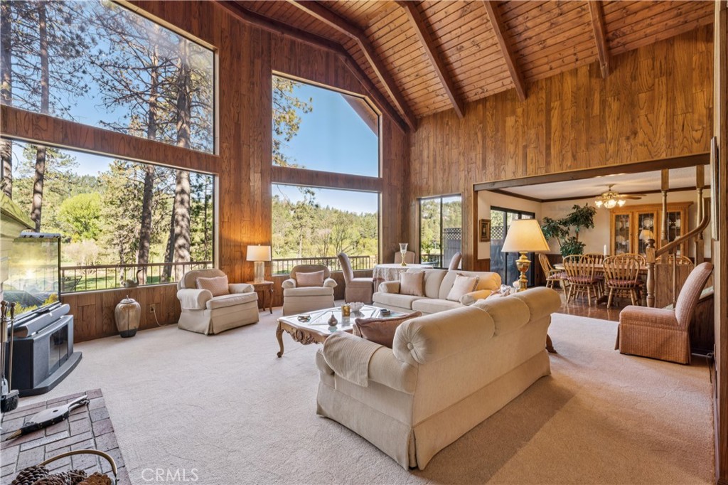 524 Golf Course Road Lake Arrowhead, CA 92352 - Photo 4 of 71 a living room with furniture and a large window
