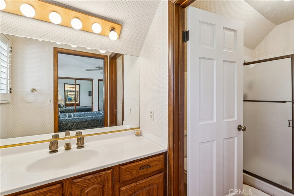 524 Golf Course Road Lake Arrowhead, CA 92352 - Photo 42 of 71 a bathroom with a sink and a mirror