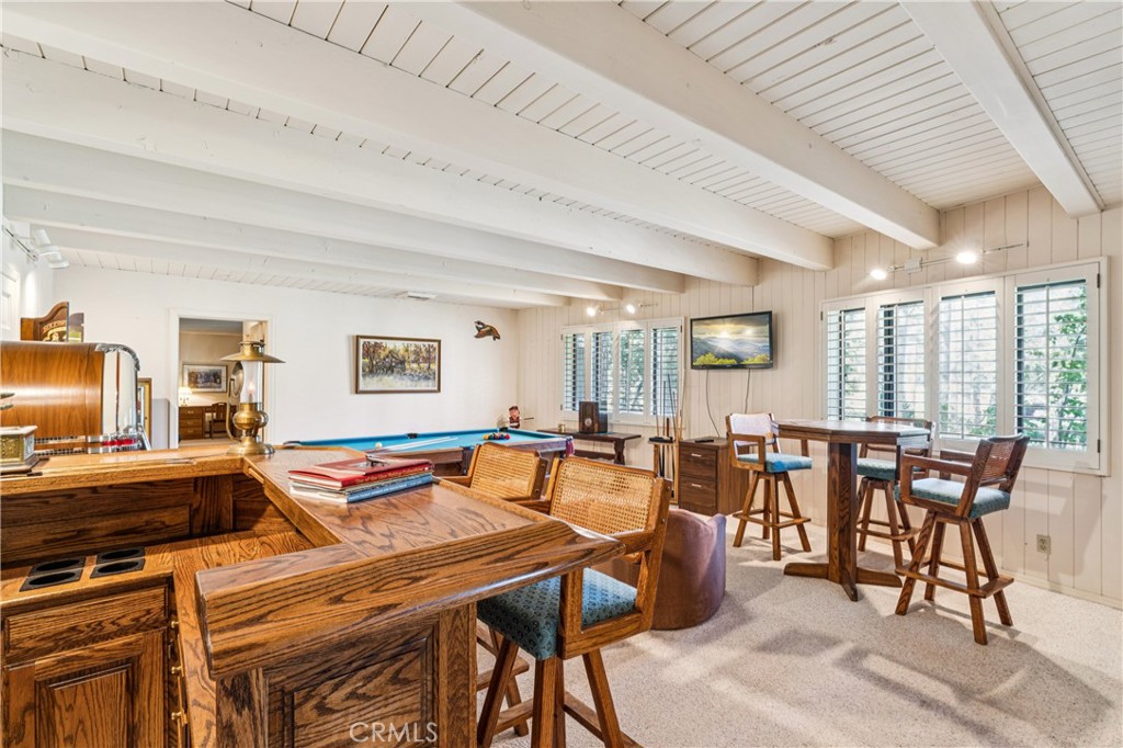 524 Golf Course Road Lake Arrowhead, CA 92352 - Photo 45 of 71 a dining hall with furniture a large window and a potted plant