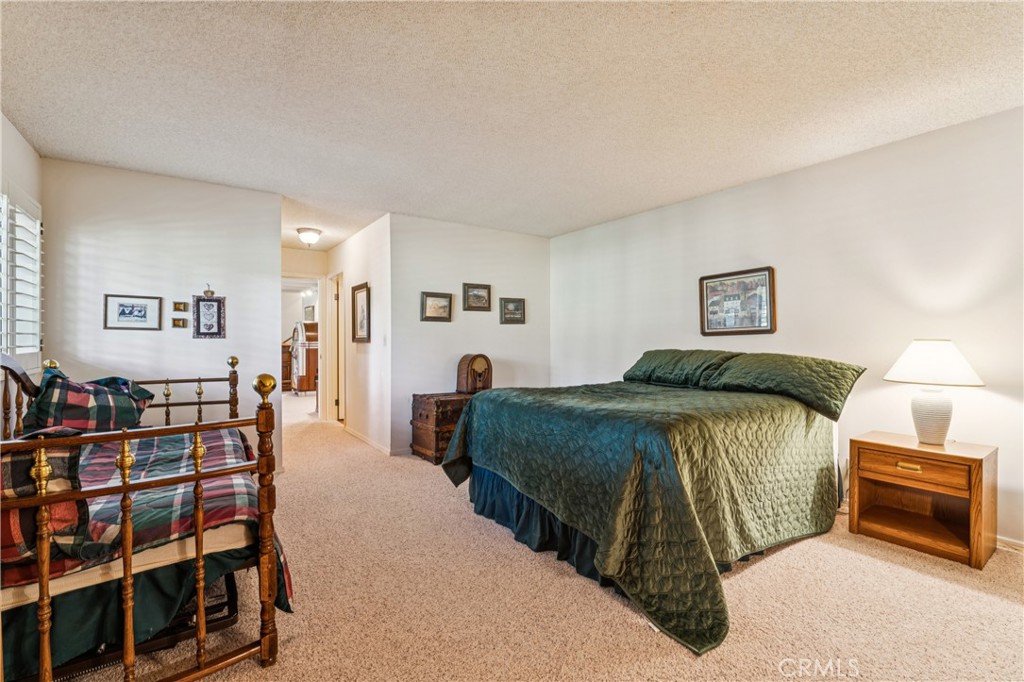 524 Golf Course Road Lake Arrowhead, CA 92352 - Photo 49 of 71 a bedroom with a bed and a cabinets