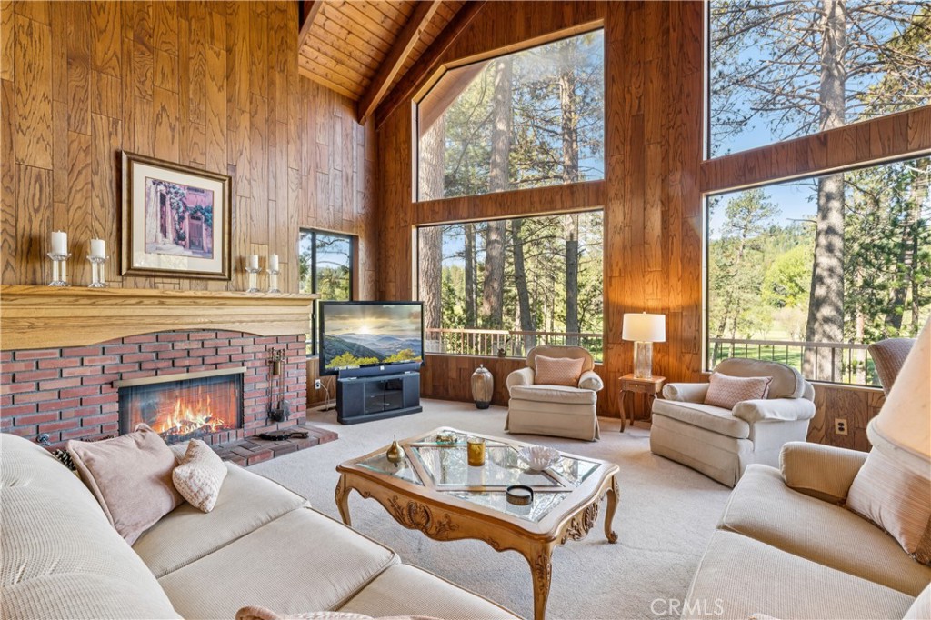 524 Golf Course Road Lake Arrowhead, CA 92352 - Photo 5 of 71 a living room with furniture large window and fireplace