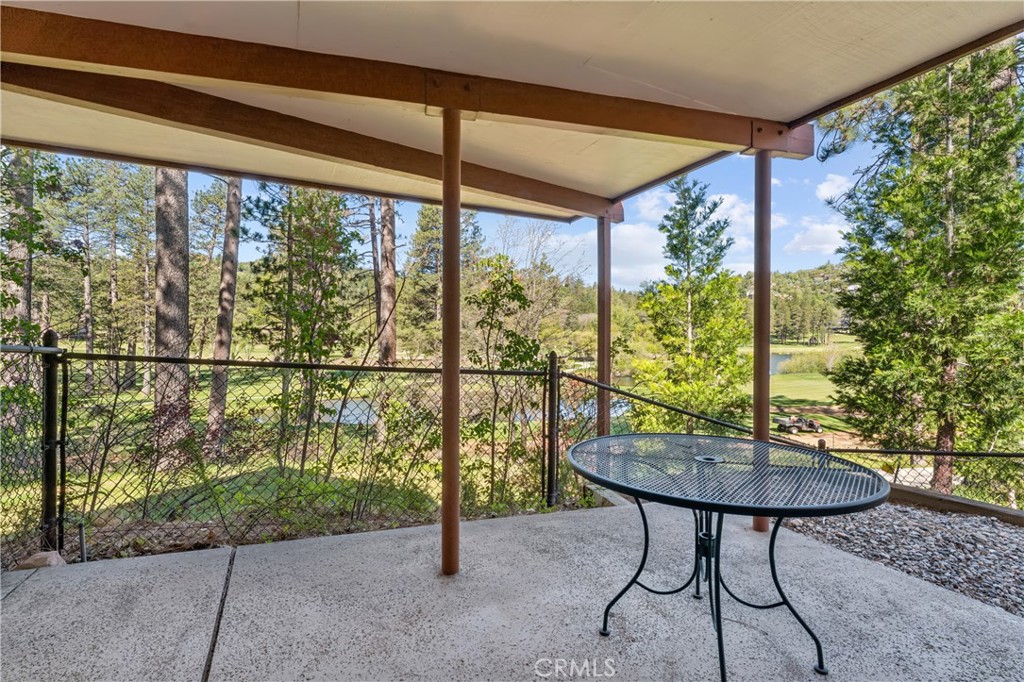 524 Golf Course Road Lake Arrowhead, CA 92352 - Photo 51 of 71 a view of a porch with furniture and a yard