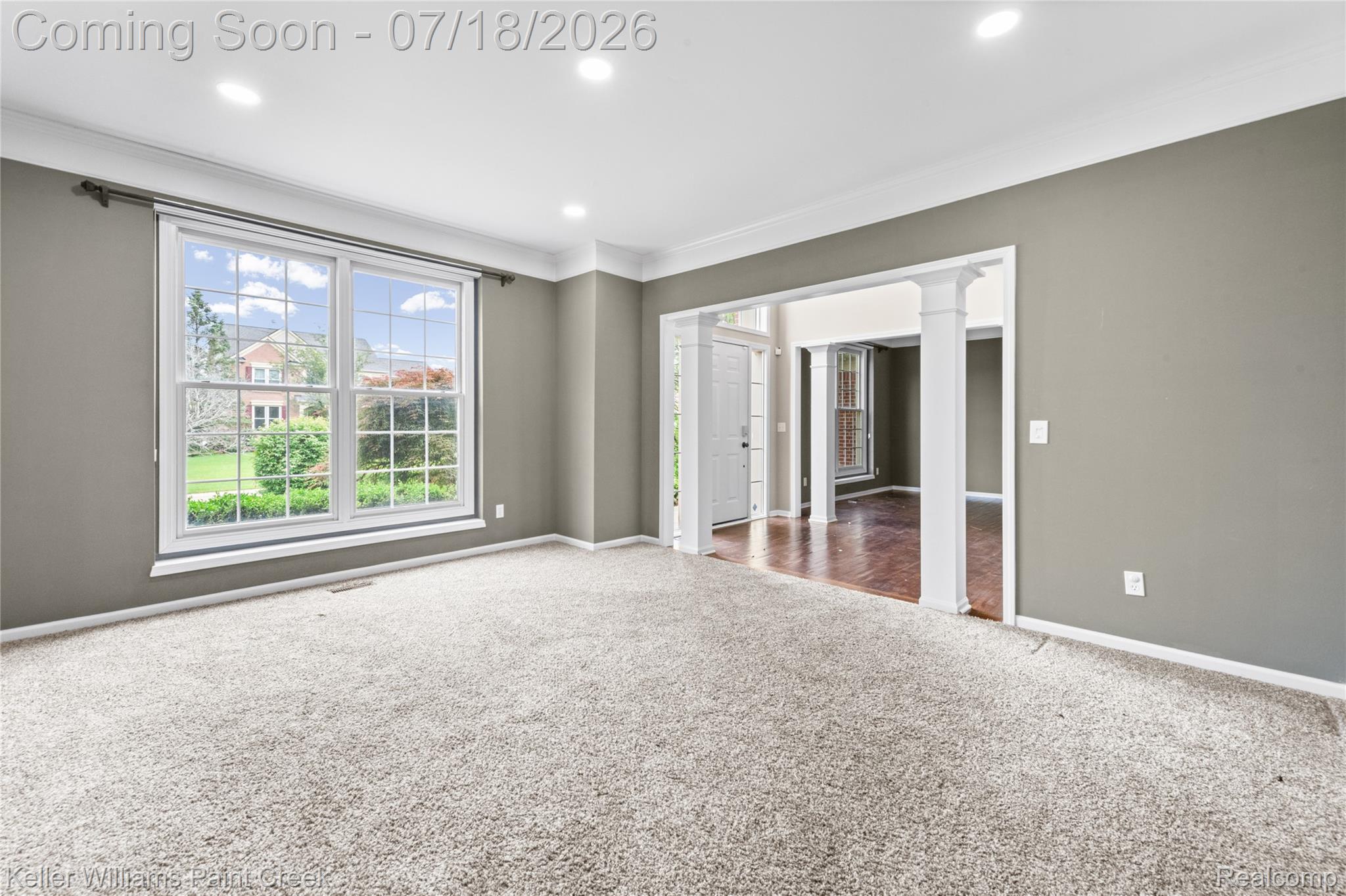 4230 Holly Lane Rochester, MI 48306 - Photo 9 of 64 Carpeted room featuring a large window, recessed lighting, and crown molding