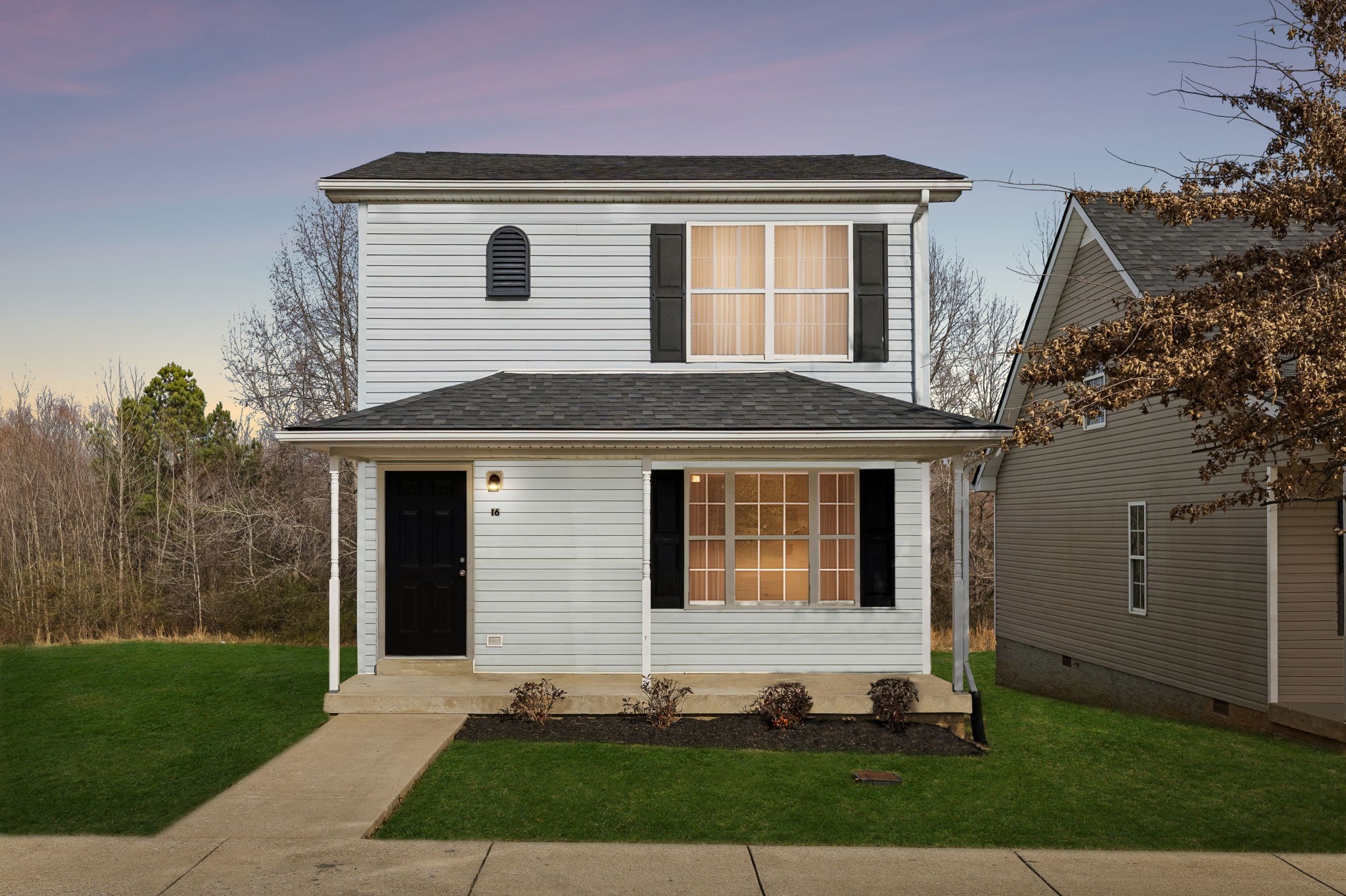 2607 Landrum Court, Unit 16 Springfield, TN 37172 - Photo 1 of 30 a front view of a house with a yard