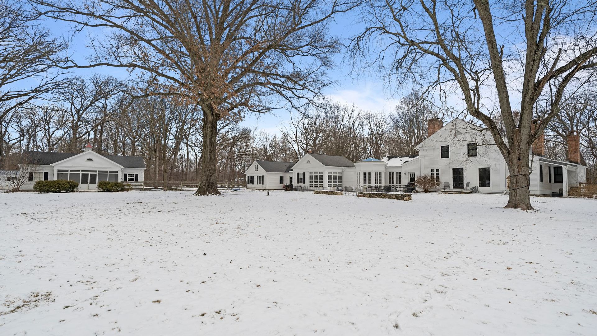 33W179 Surrey Road Wayne, IL 60184 - Photo 30 of 39 a front view of a house with a yard covered in snow
