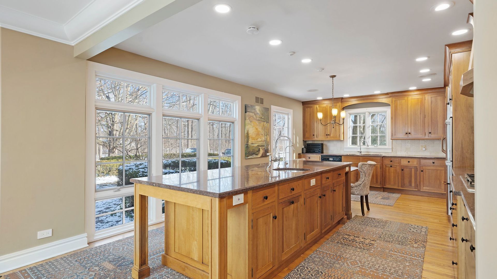 33W179 Surrey Road Wayne, IL 60184 - Photo 3 of 39 a large kitchen with kitchen island granite countertop a large window and a counter space