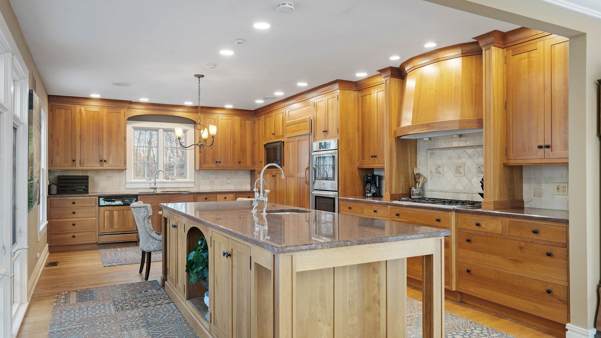 33W179 Surrey Road Wayne, IL 60184 - Photo 4 of 39 a kitchen with stainless steel appliances granite countertop a sink and cabinets