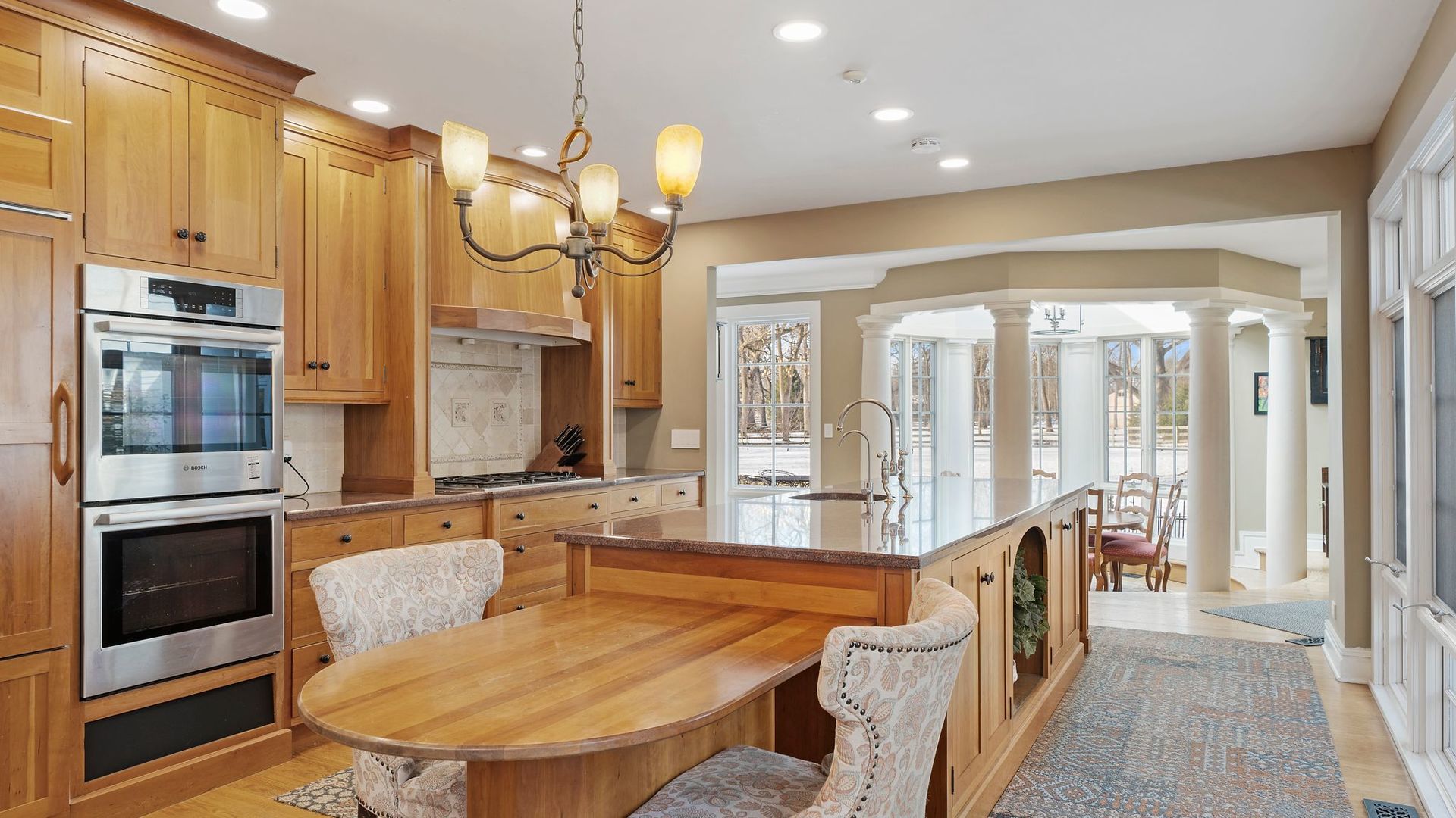 33W179 Surrey Road Wayne, IL 60184 - Photo 5 of 39 a large kitchen with a large window and stainless steel appliances