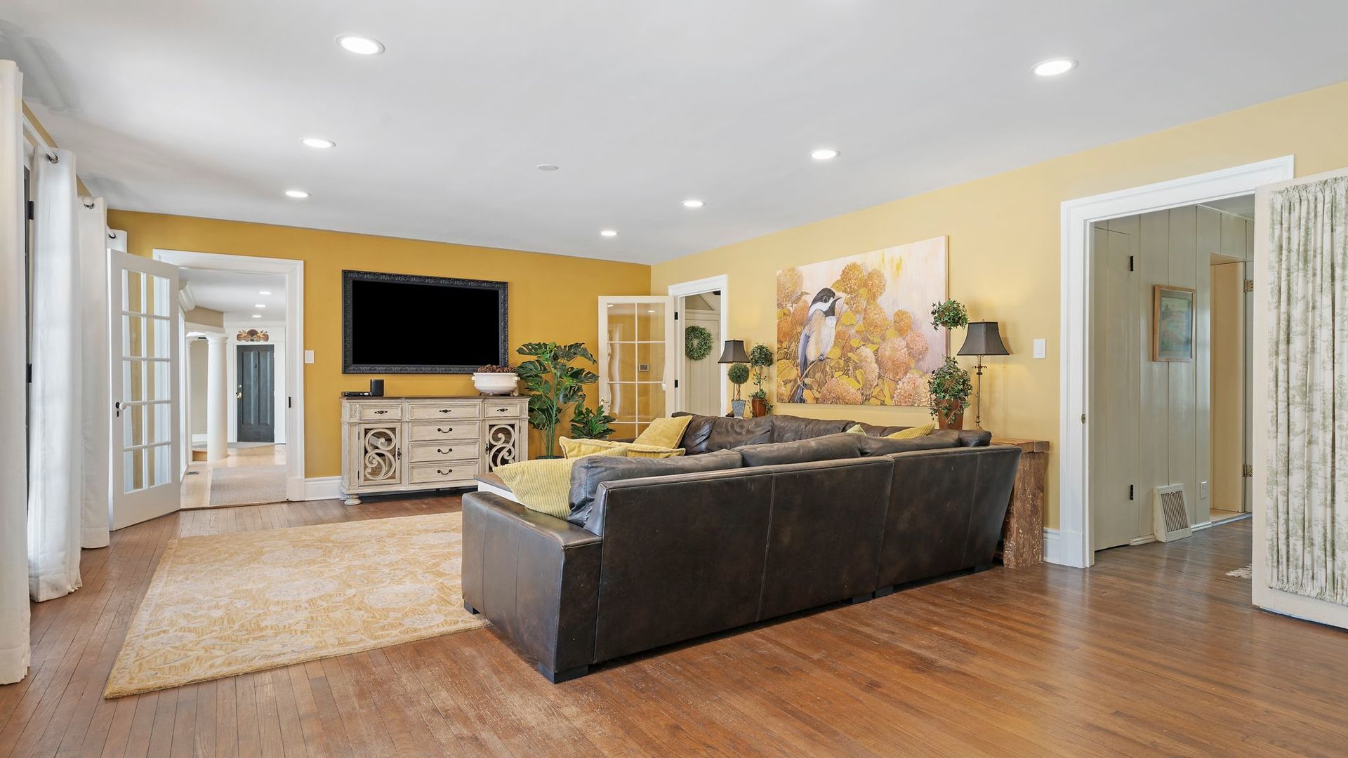 33W179 Surrey Road Wayne, IL 60184 - Photo 9 of 39 a living room with furniture and a flat screen tv