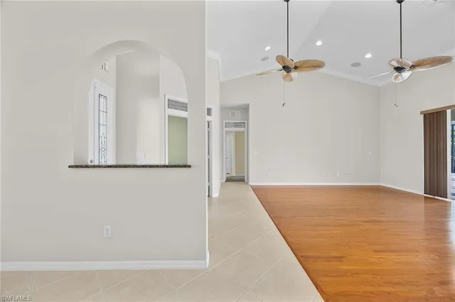 a view of a room with a ceiling fan