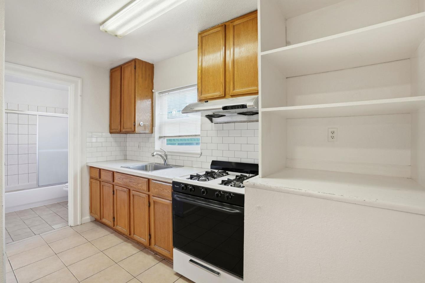603 Madison Street Oakland, CA 94607 - Photo 16 of 43 a kitchen with cabinets and appliances