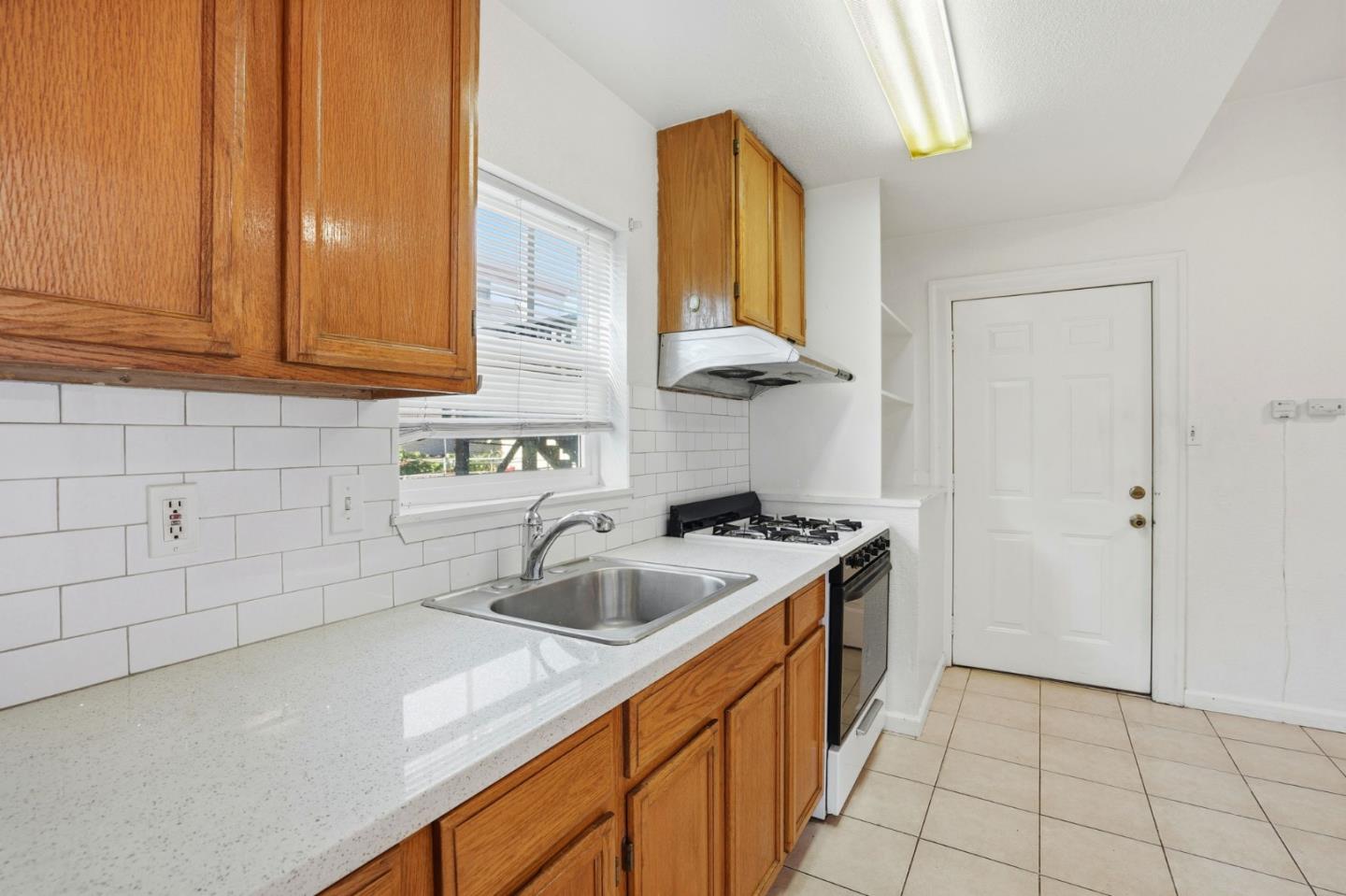 603 Madison Street Oakland, CA 94607 - Photo 17 of 43 a kitchen with a sink and cabinets