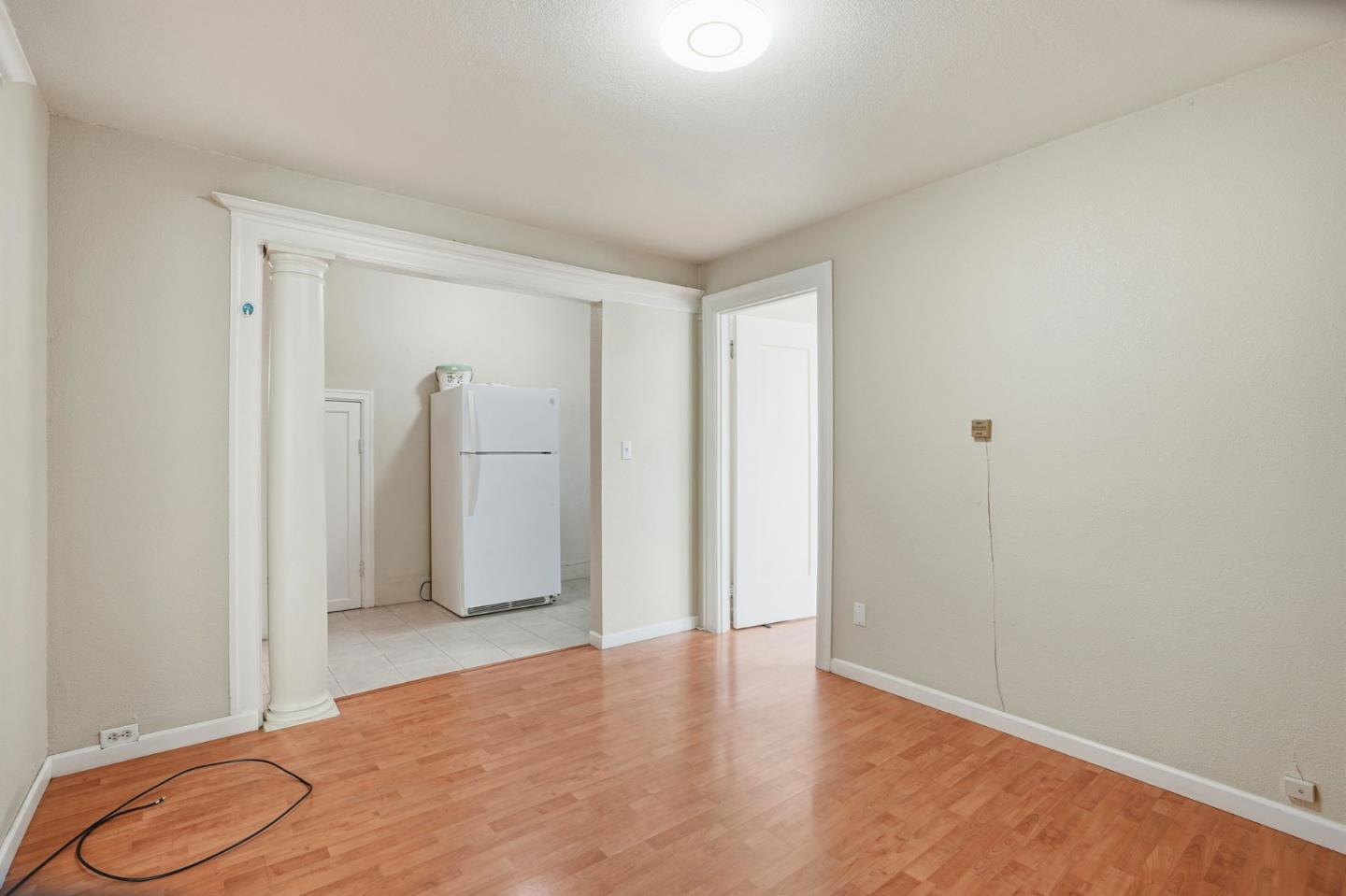 603 Madison Street Oakland, CA 94607 - Photo 21 of 43 a view of a room with wooden floor and shower