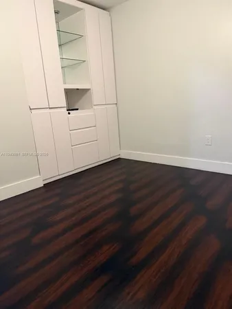 a view of an empty walk in closet
