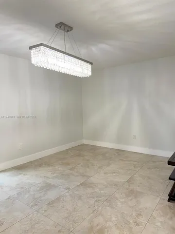 a view of a chandelier fan in a room