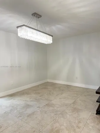 a view of a chandelier fan in a room