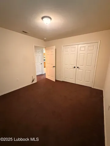 an empty room with a empty space and windows