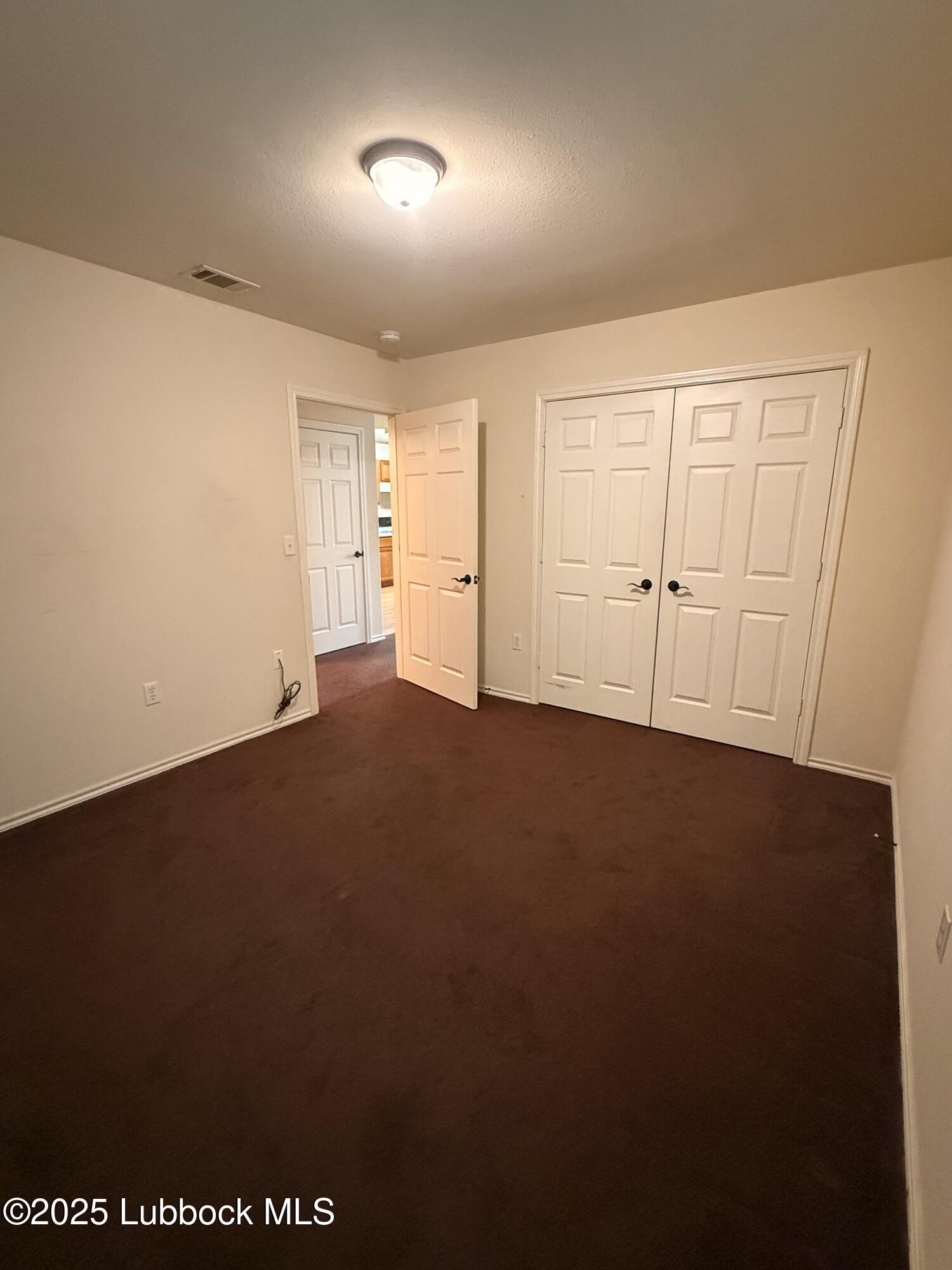 307 East 3rd Street Muleshoe, TX 79347 - Photo 11 of 20 an empty room with a empty space and windows