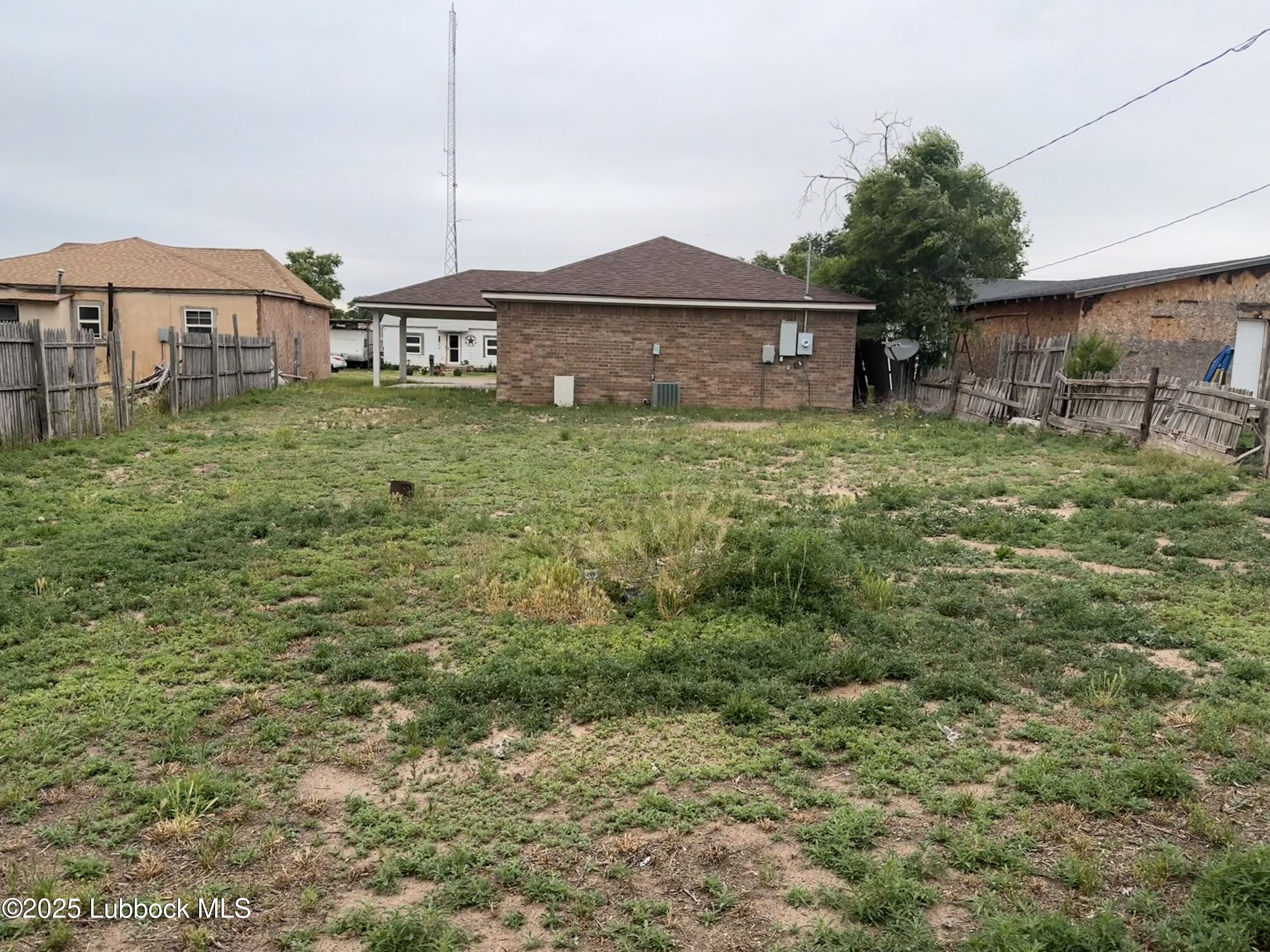 307 East 3rd Street Muleshoe, TX 79347 - Photo 20 of 20 a front view of a house with a yard