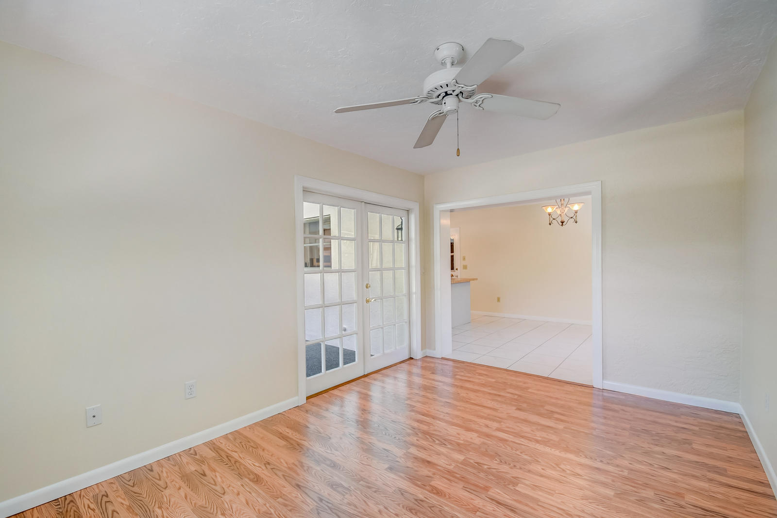 22298 Garrison Street Boca Raton, FL 33428 - Photo 30 of 62 a view of an empty room with wooden floor and a window