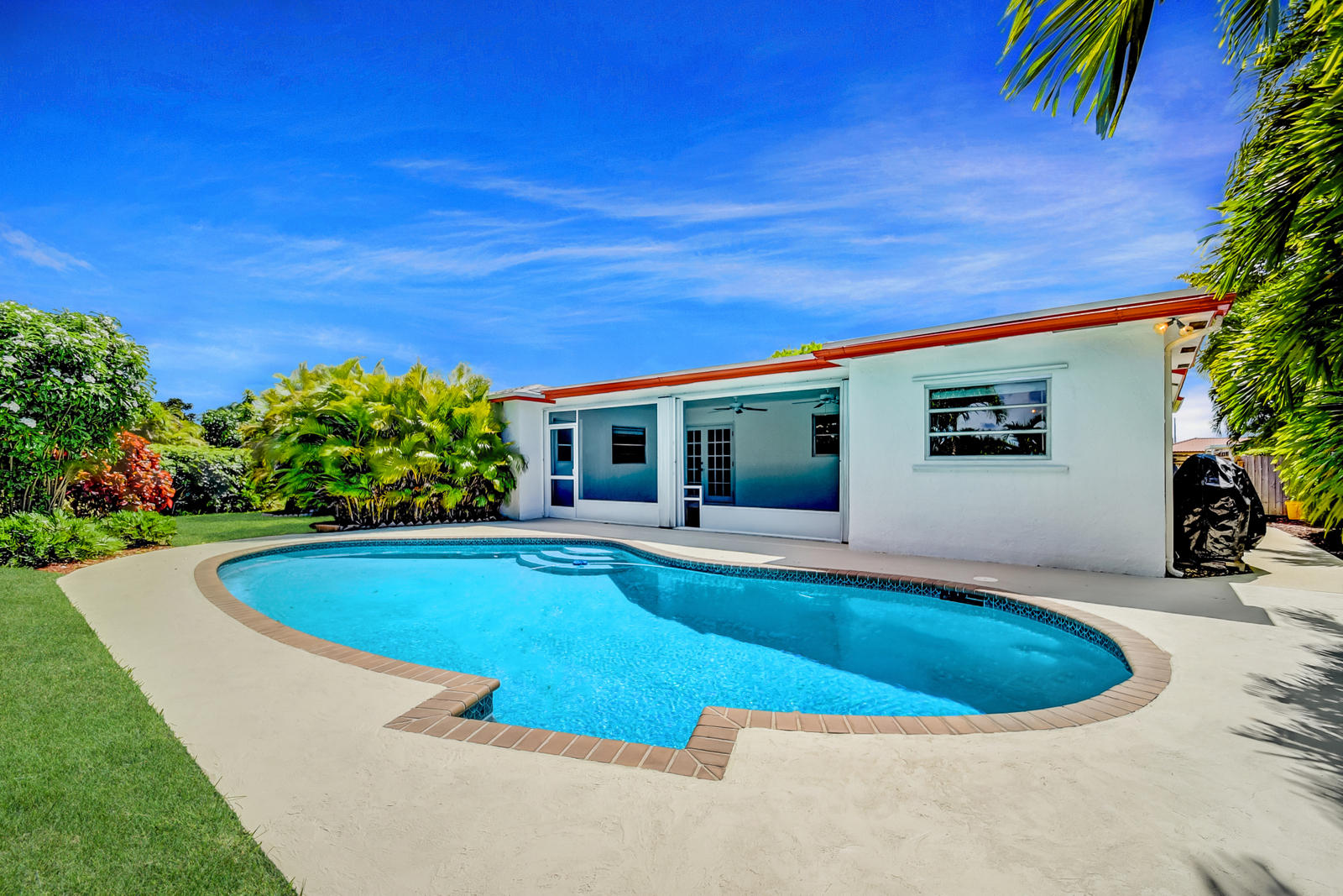 22298 Garrison Street Boca Raton, FL 33428 - Photo 4 of 62 a view of a house with swimming pool