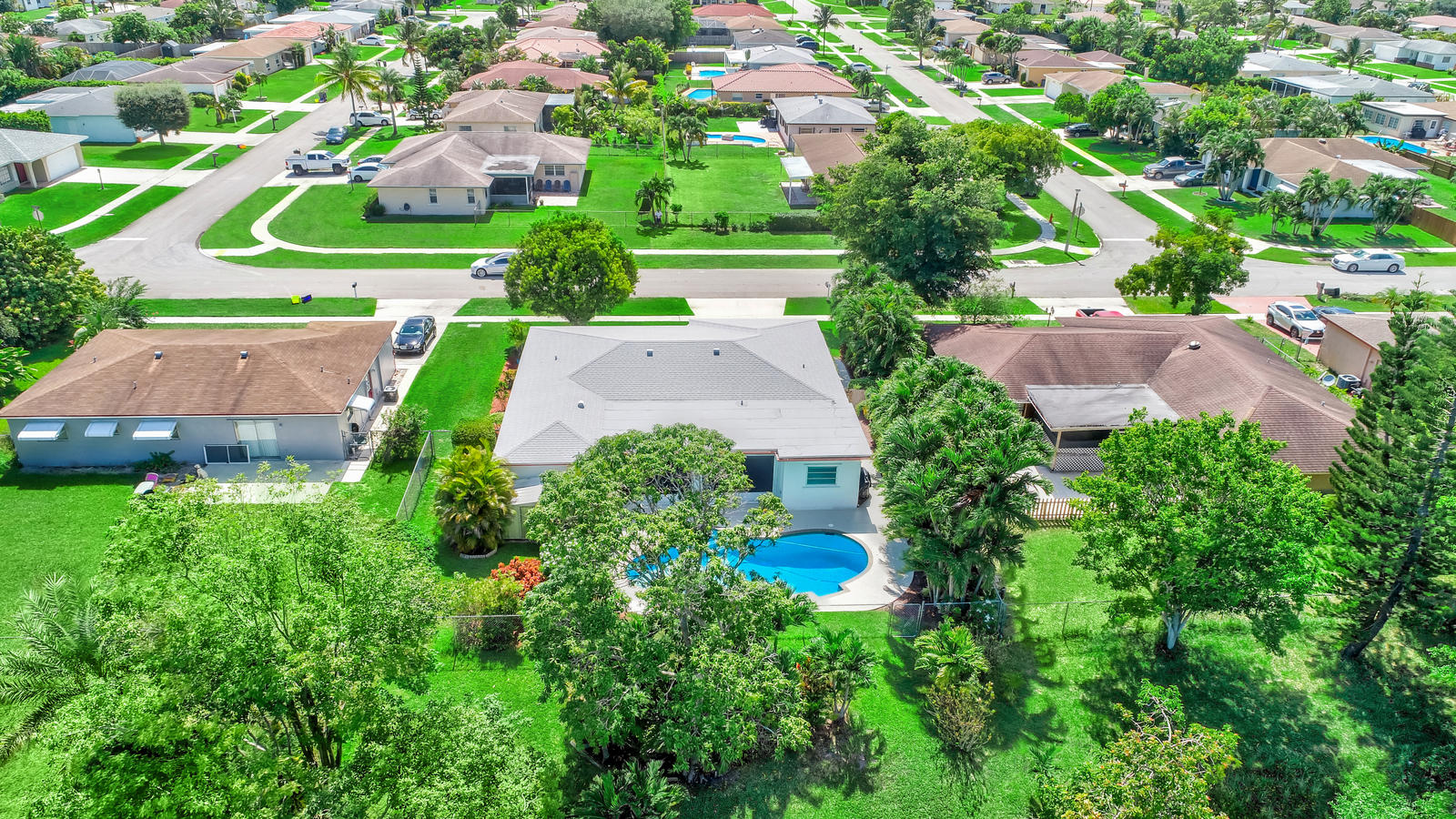 22298 Garrison Street Boca Raton, FL 33428 - Photo 51 of 62 an aerial view of residential houses with outdoor space and trees all around