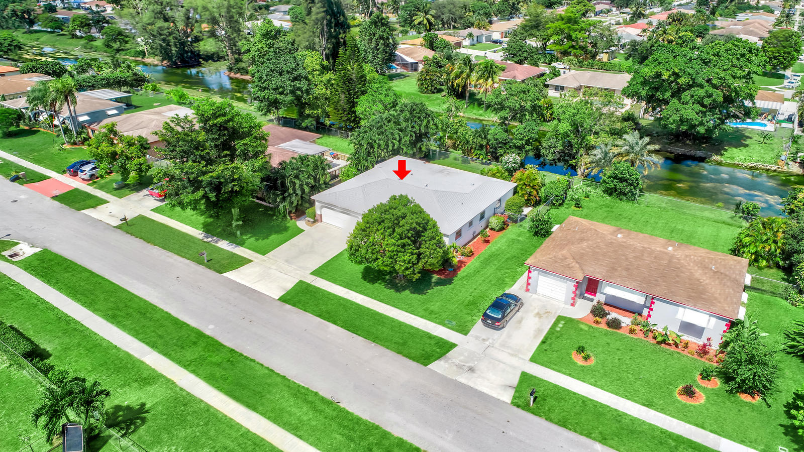 22298 Garrison Street Boca Raton, FL 33428 - Photo 54 of 62 a green field with lots of trees in the background
