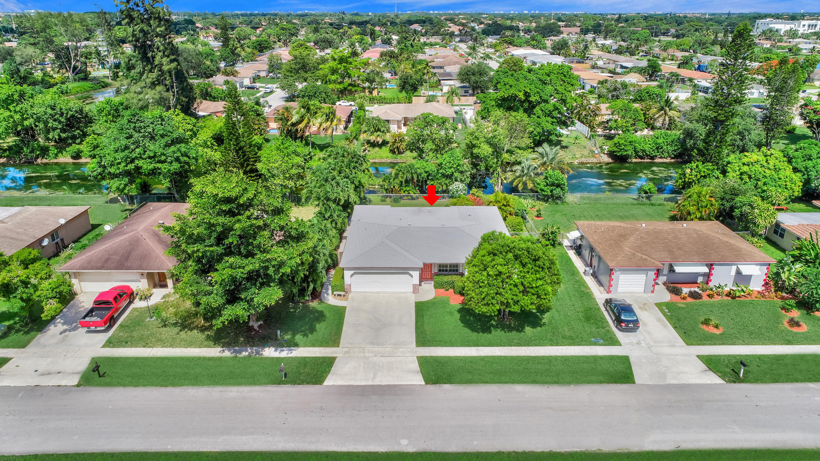 22298 Garrison Street Boca Raton, FL 33428 - Photo 55 of 62 an aerial view of residential houses with outdoor space and trees