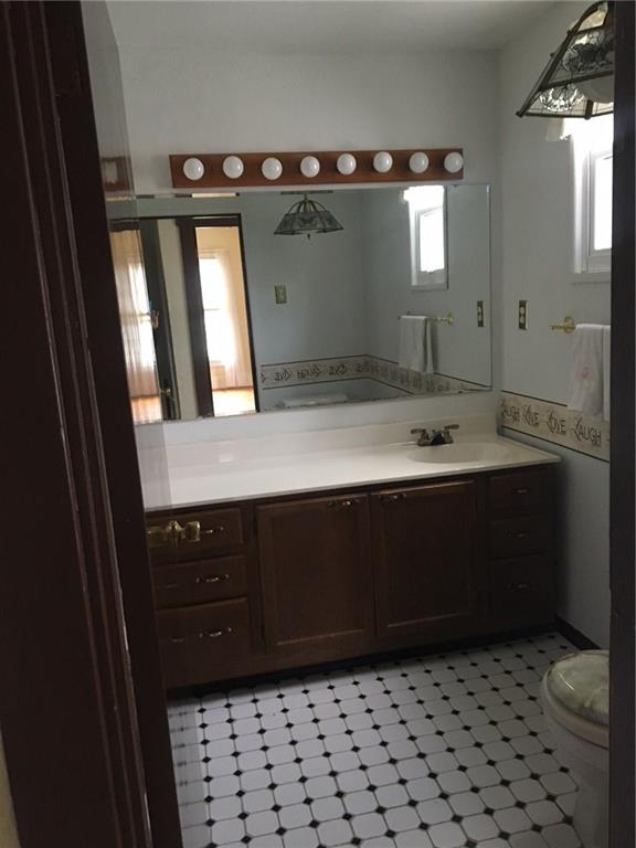 115 Lindsay Road Carnegie, PA 15106 - Photo 12 of 18 Main Bath feautures Black and White Tile Floor and Vanity with White Marble top/sink