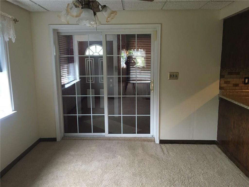 115 Lindsay Road Carnegie, PA 15106 - Photo 5 of 18 Updated Sliders lead to Sunroom/Den and Rear Yard/2 Car Garage.