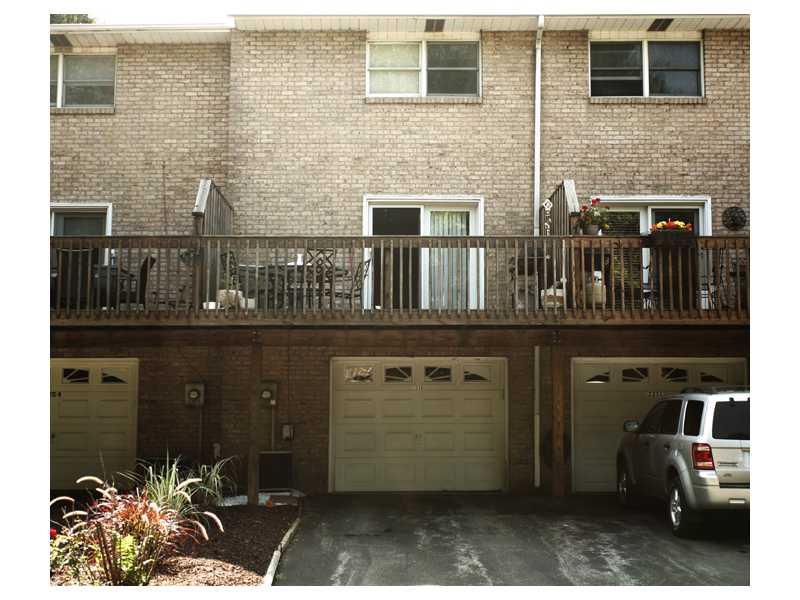 225 B Stone Quarry Road, Unit B Monaca, PA 15061 - Photo 10 of 11 Exterior Back. Over sized garage door leads to the basement/laundry room, access from the main floor also.