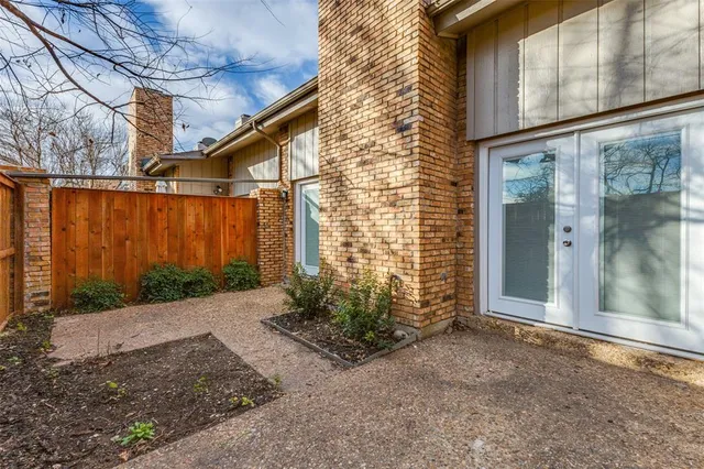 a view of a pathway along the house